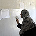Iraqi woman looks at voting lists